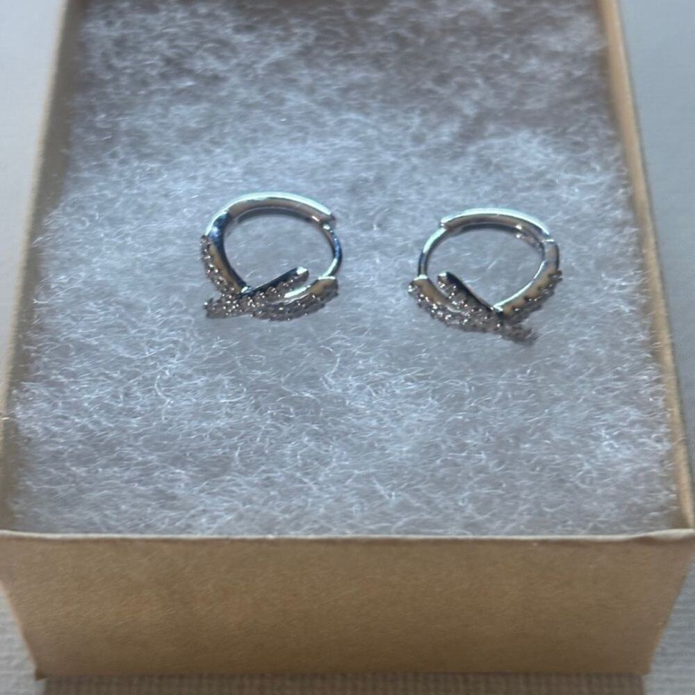 Sterling Silver Huggie
Hoop Earrings with Pave
CZ X-Design